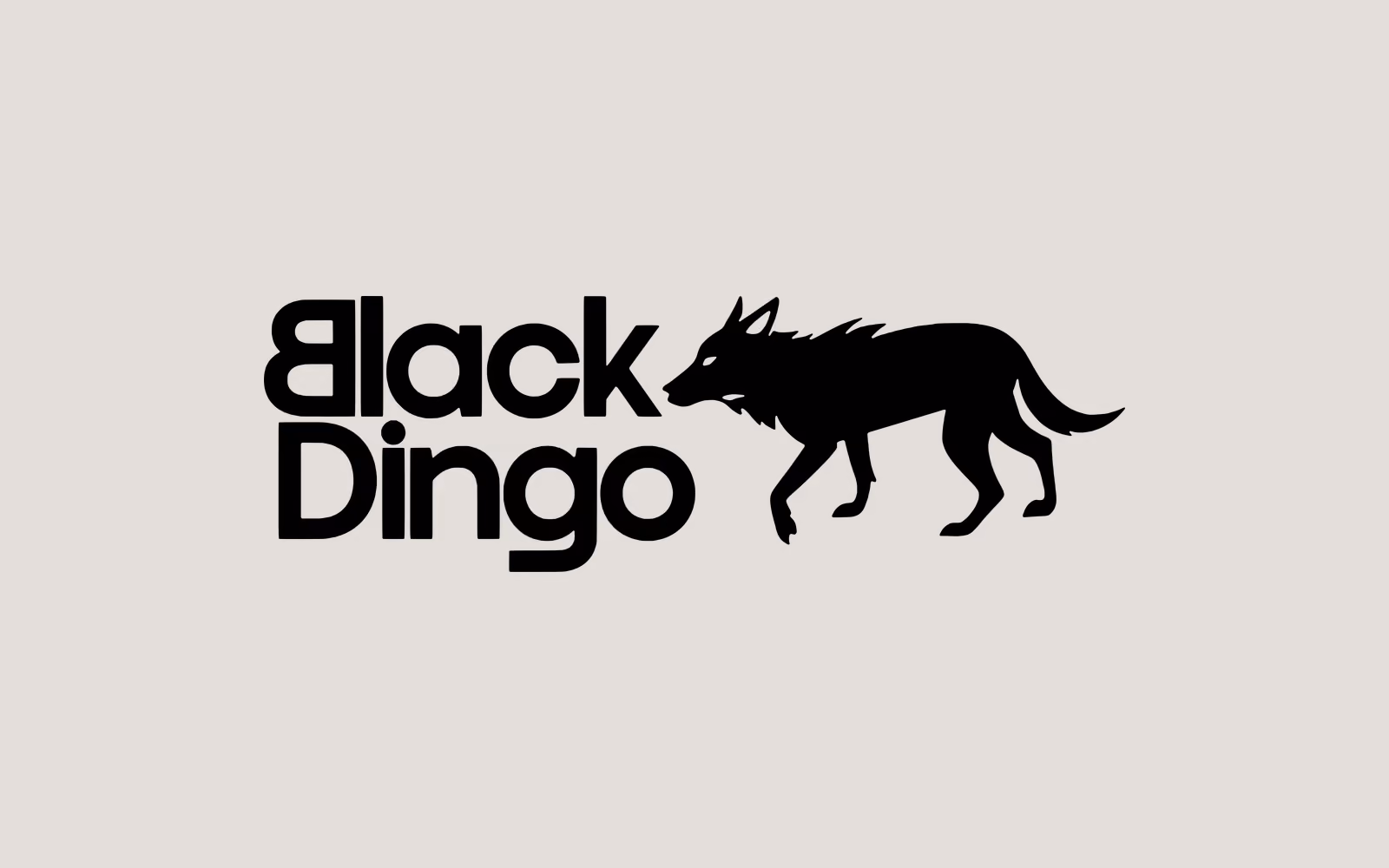 The Black Dingo stacked lockup in black on warm grey: the words Black Dingo set heavy over two lines beside a walking dingo silhouette.