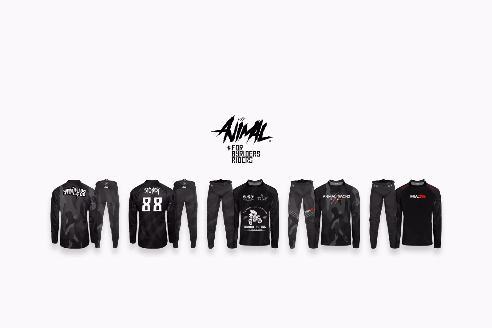 Animal Racing applied to product: long sleeve jerseys, pants and tees laid flat in black and grey with the wordmark and race numbers placed.