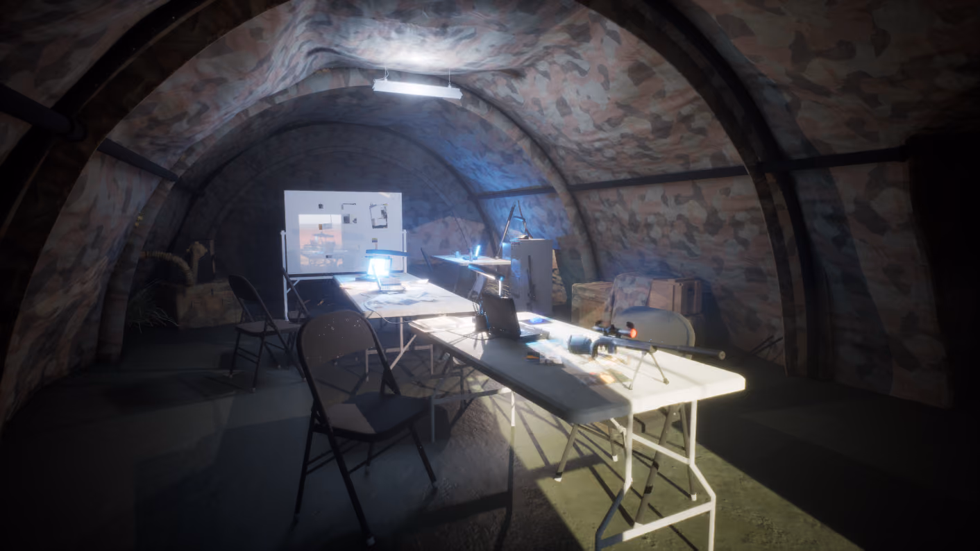 The full briefing tent interior under a single overhead fluorescent, folding chairs pulled up to two trestle tables, whiteboard at the far end.
